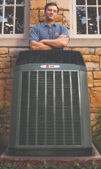 Hvac Tech Stands Behind Trane Air Conditioner (1)